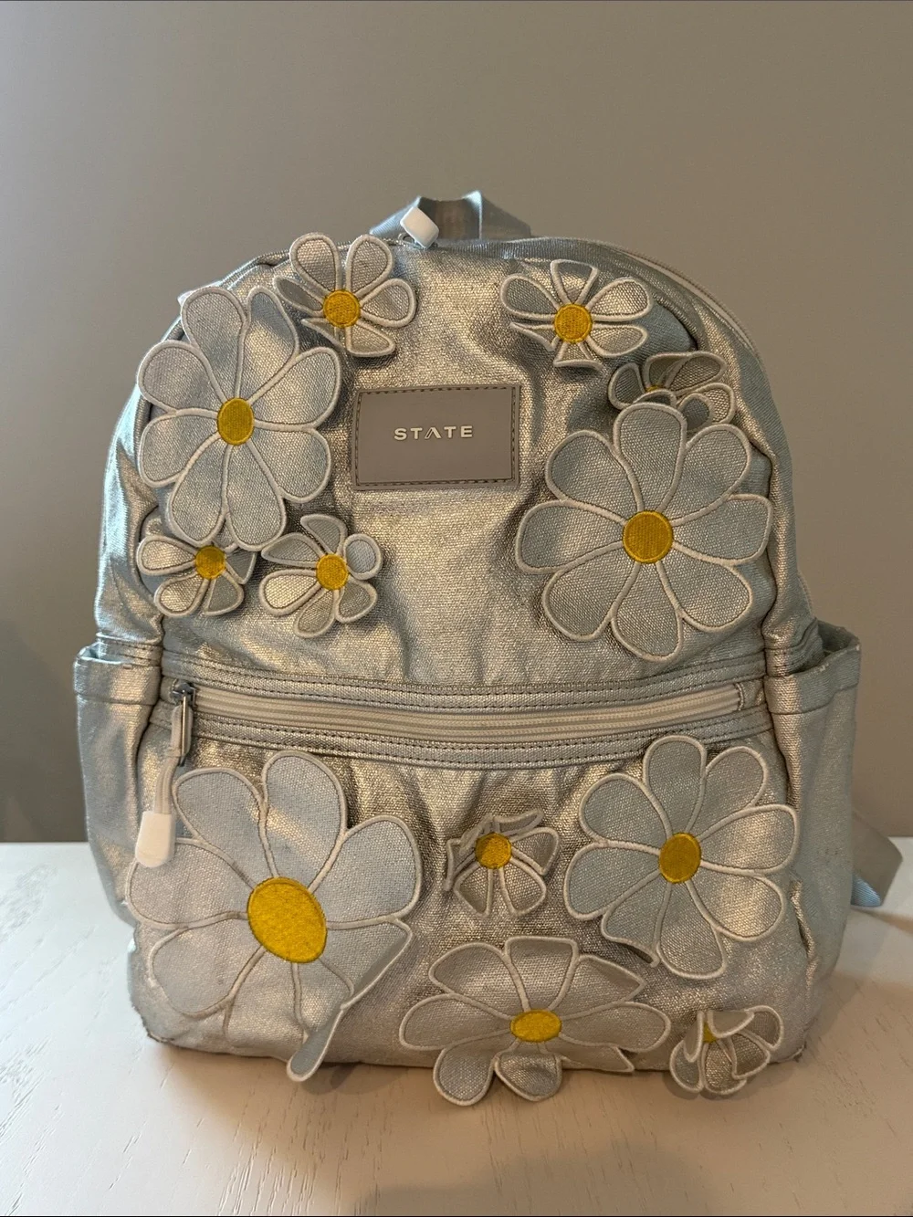 STATE Metallic Silver Daisy Patch Kane Kids Mini Backpack